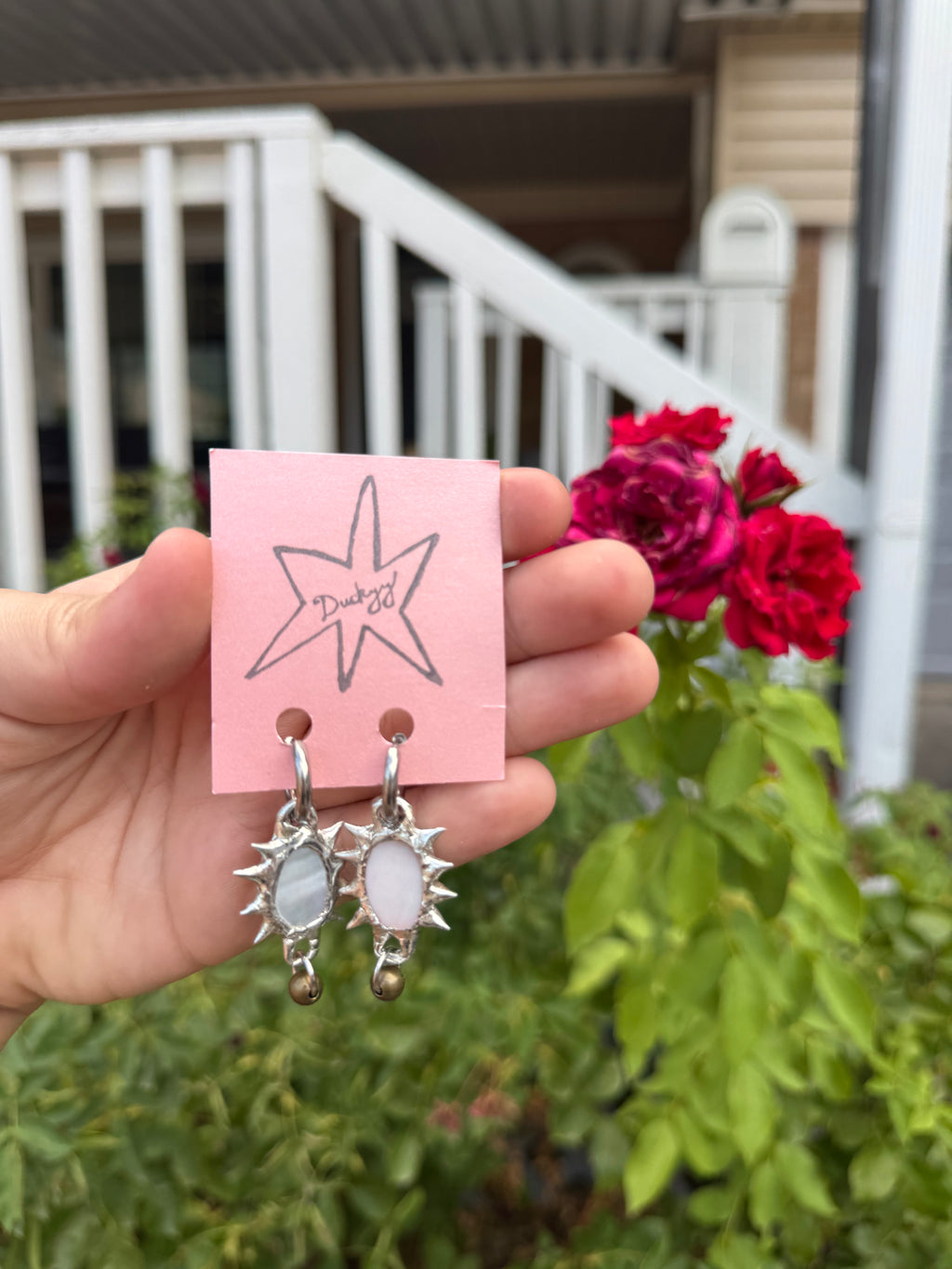 mother of pearl oval with charm earrings